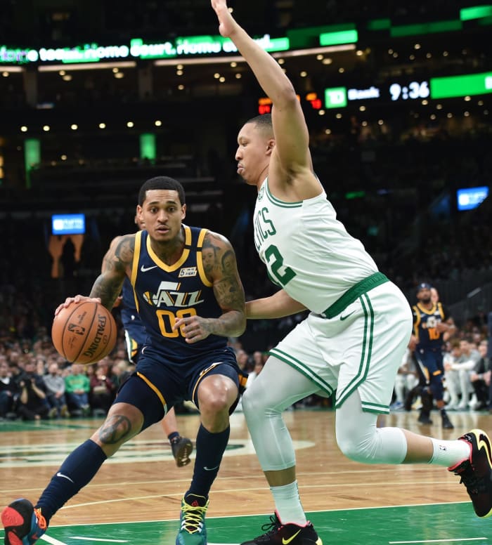 Jordan Clarkson (00) backs down a defender on his way to the hoop